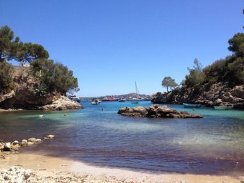 Scenic view of sea against clear blue sky