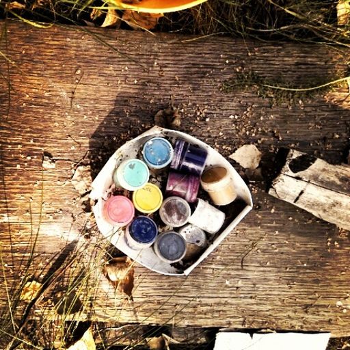 high angle view, wood - material, still life, wooden, large group of objects, abandoned, variation, wood, directly above, day, close-up, table, childhood, multi colored, no people, toy, broken, stack, outdoors, container