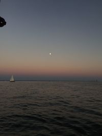 Scenic view of sea against clear sky during sunset