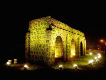 Illuminated light painting of historic building at night