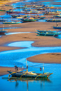 High angle view of boats moored at beach