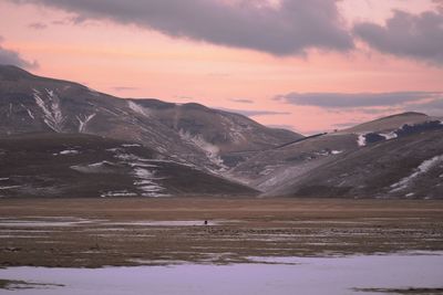 Scenic view of mountains against sky during sunset