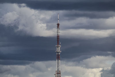 Low angle view of communications tower against sky