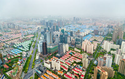 High angle view of street amidst buildings in city