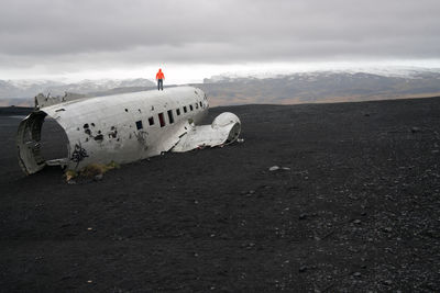 View of abandoned airplane on landscape