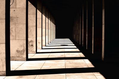 Sunlight and shadow in corridor of historic building