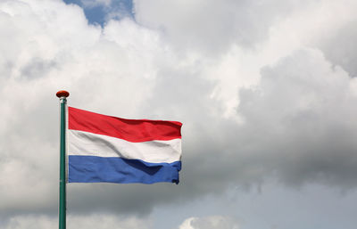 Low angle view of flag against sky