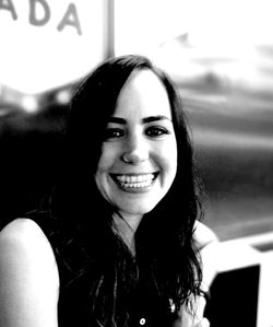 Close-up portrait of a smiling young woman