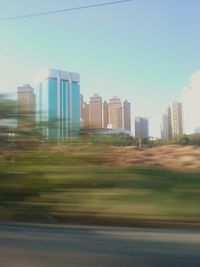 Skyscrapers in city against clear sky