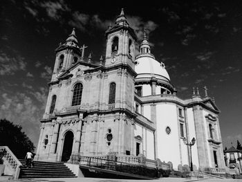 Low angle view of cathedral against cloudy sky