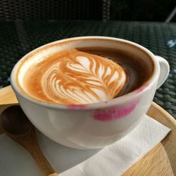 Close-up of cappuccino on table