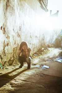 Portrait of young woman sitting outdoors