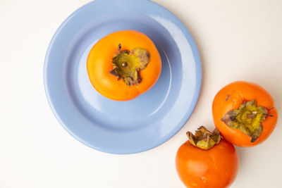 High angle view of orange fruit on table