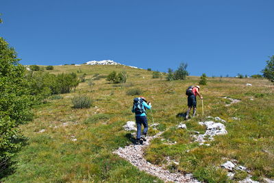 Senior couple hiking in velebit mountain, croatia