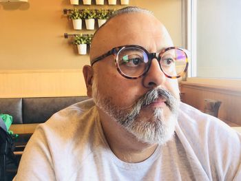 Portrait of man wearing eyeglasses