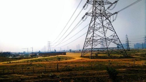 Electricity pylon on field