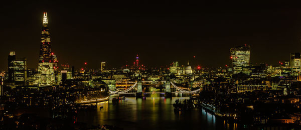 Illuminated buildings in city at night