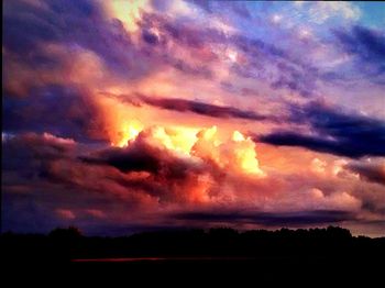 Scenic view of landscape against cloudy sky