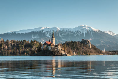 Scenic view of lake with mountain range in background