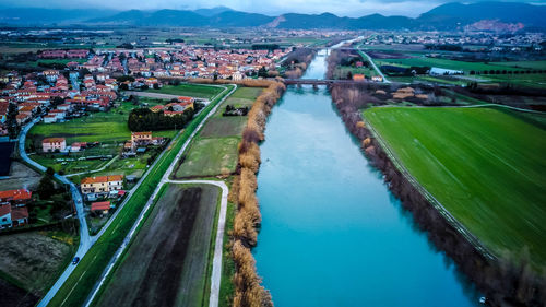 High angle view of river amidst buildings in city