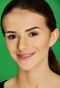 Portrait of young woman wearing braces