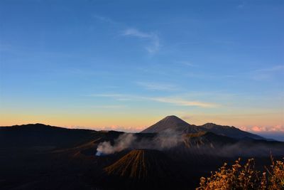 View of volcanic landscape against sky during sunset