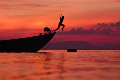 Silhouette of people at sunset