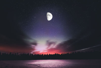 Scenic view of lake against star field at night