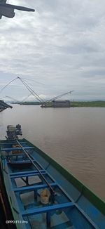 Bridge over river against sky