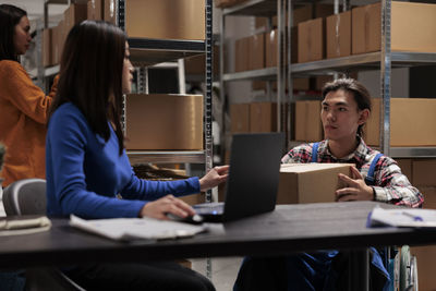 Young woman using laptop at office