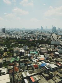 High angle view of buildings in city against sky