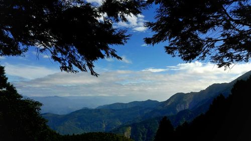 Scenic view of silhouette mountains against sky