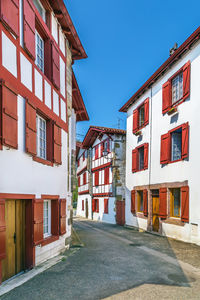 Street amidst buildings against sky