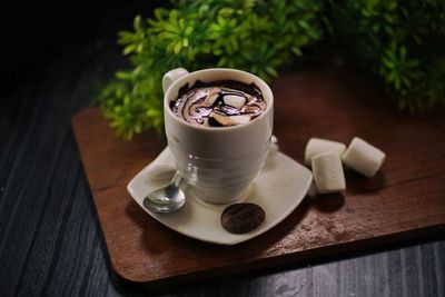 Close-up of coffee cup on table