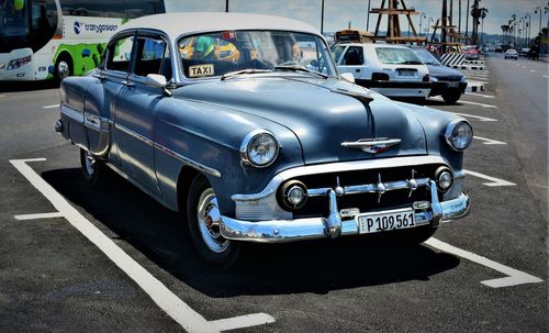 View of cars parked on road