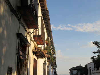 Low angle view of houses against sky