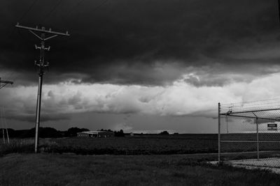 Street light on field against sky