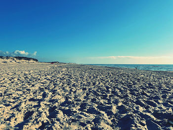 Scenic view of sea against blue sky
