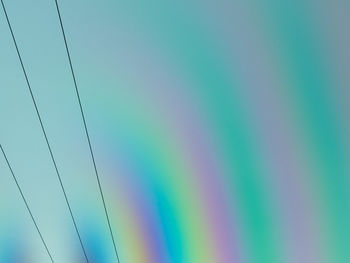 Low angle view of cables against clear sky