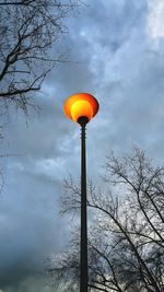 Low angle view of street light against sky