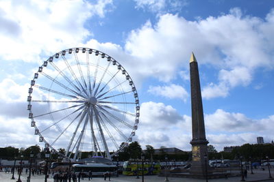 Low angle view of ferris wheel against sky