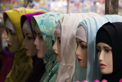 Female mannequins with colorful hijabs in store