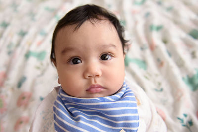 Close up face of little cute asian baby, look at camera