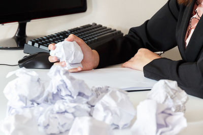 Midsection of person working on table