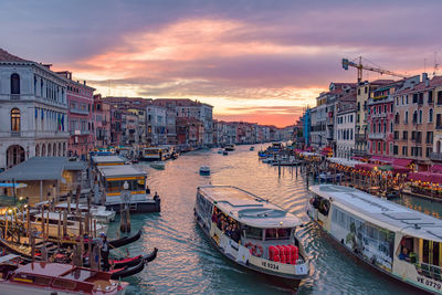 High angle view of canal amidst buildings in city