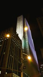 Low angle view of illuminated modern building