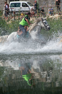 People in water splashing