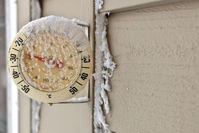 Close-up of clock on wall