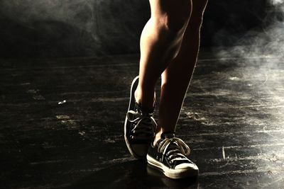 Low section of man standing outdoors