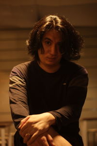 Portrait of young man sitting outdoors